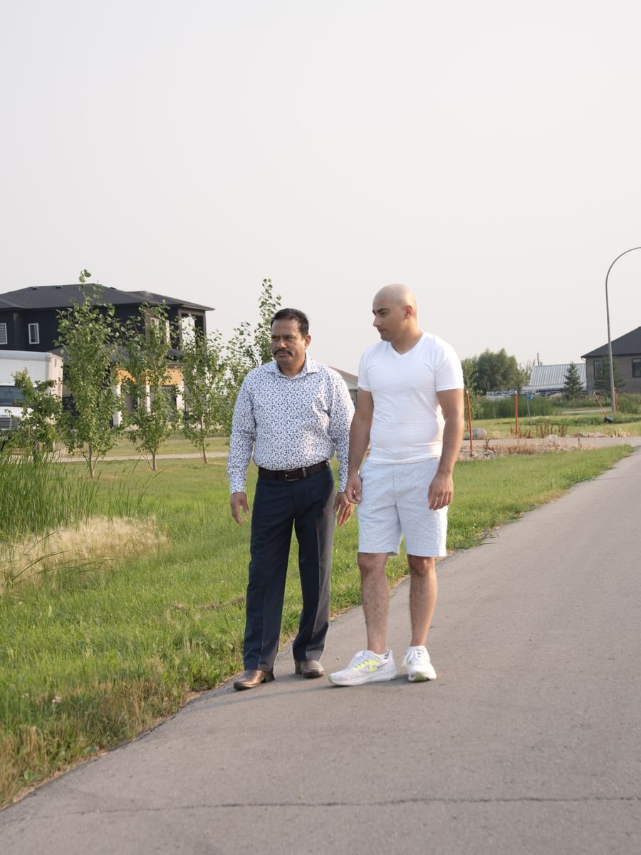 Jacky Maan walking a path in his West St. Paul neighbourhood